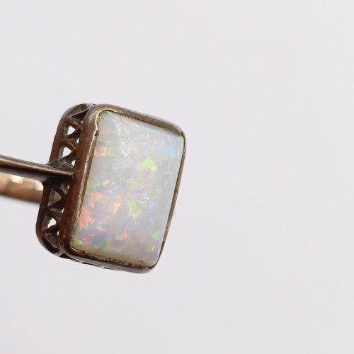 784 - A yellow coloured metal and opal ring, ring size D, and a platinum wedding band, ring size I 1/2 (2)