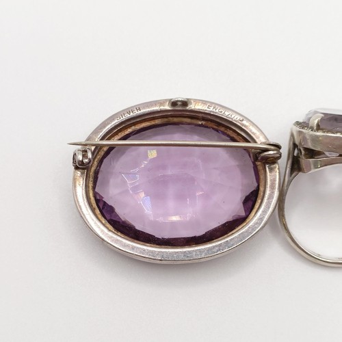 772 - A silver coloured metal, white stone and amethyst brooch, and a similar ring (2)