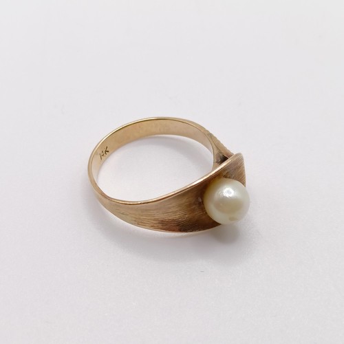 758 - A 14ct gold and pearl ring, ring size N, 3.6 g all in,