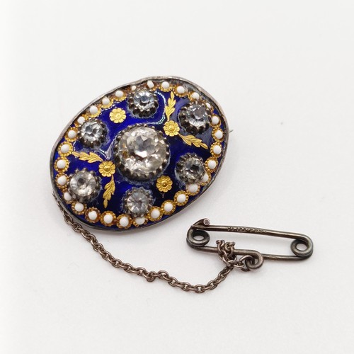 756 - A late 19th/early 20th century silver coloured metal enamel and paste brooch