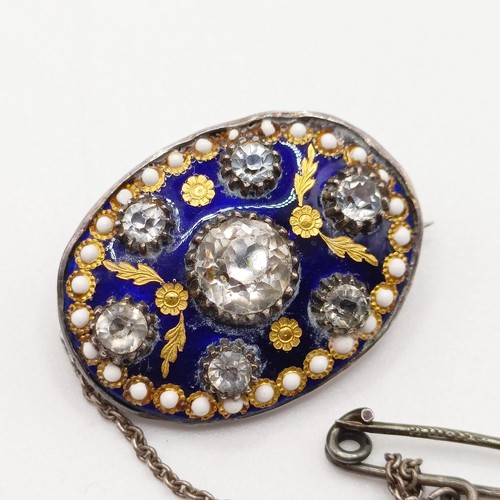 756 - A late 19th/early 20th century silver coloured metal enamel and paste brooch