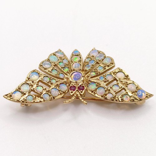 714 - A 9ct gold and opal butterfly brooch