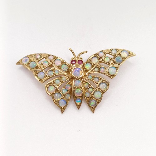 714 - A 9ct gold and opal butterfly brooch