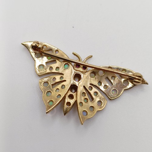 714 - A 9ct gold and opal butterfly brooch