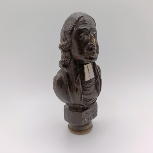 715 - A 19th century carved seal, in the form of a John Wesley, 8 cm high