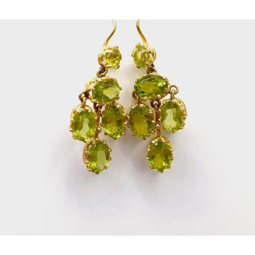 688 - A pair of yellow metal and green stone earrings