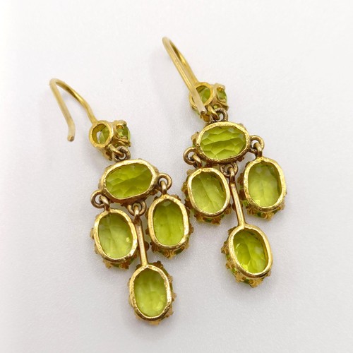 688 - A pair of yellow metal and green stone earrings