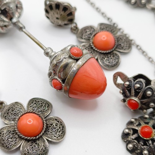 670 - An early 20th century silver coloured metal and coral necklace, a similar necklace, two pairs of ear... 