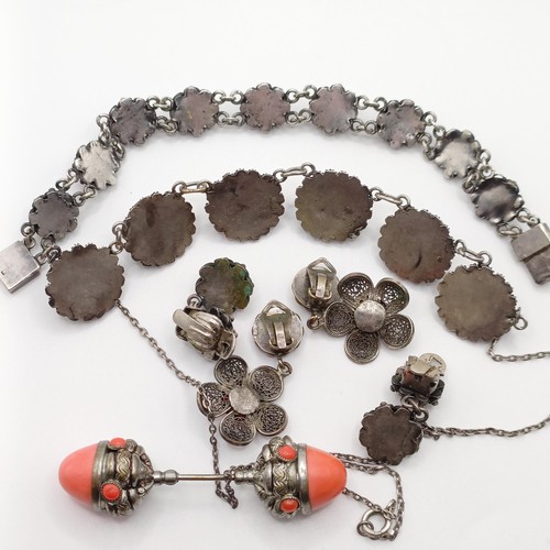 670 - An early 20th century silver coloured metal and coral necklace, a similar necklace, two pairs of ear... 