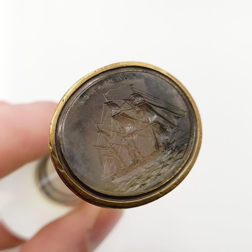 671 - A 19th century crystal and gilt metal seal, engraved a sailing ship, 9 cm high