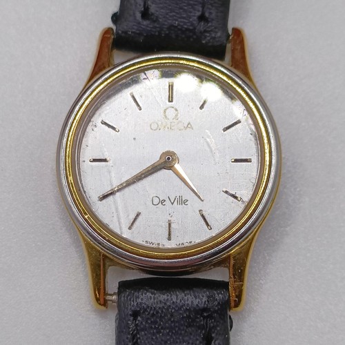 1014 - A ladies Omega wristwatch, on a leather strap