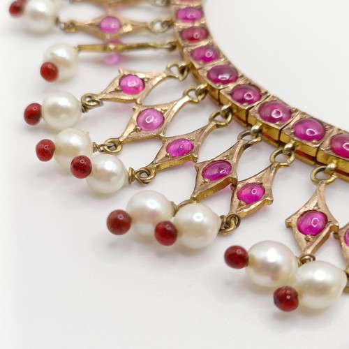 916 - An Indian gold and cabochon cut ruby and pearl fringe necklace