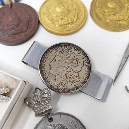 970 - An American silver dollar, converted to a money clip, assorted medals and costume jewellery