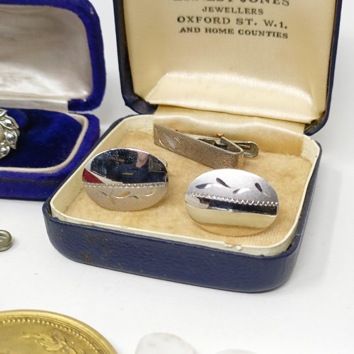 970 - An American silver dollar, converted to a money clip, assorted medals and costume jewellery