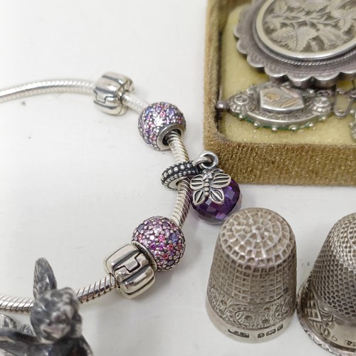 980 - A Pandora bracelet, a silver brooch with matching earrings, and assorted other silver jewellery (box... 