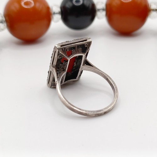 992 - An Art Deco silver, coral and marcasite panel ring, ring size S, the setting with a pierced back, an... 