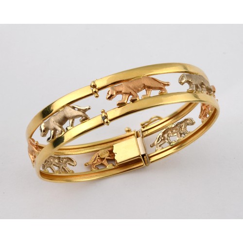 847 - An 18ct tri-colour gold bangle, decorated big cats, 21 g