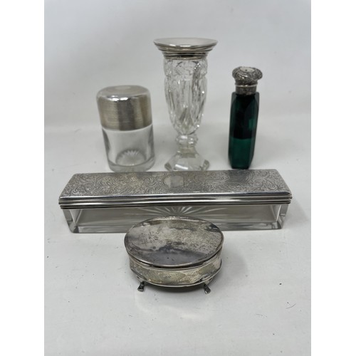 1383 - A silver mounted cut glass bottle, a scent bottle, and three other boxes