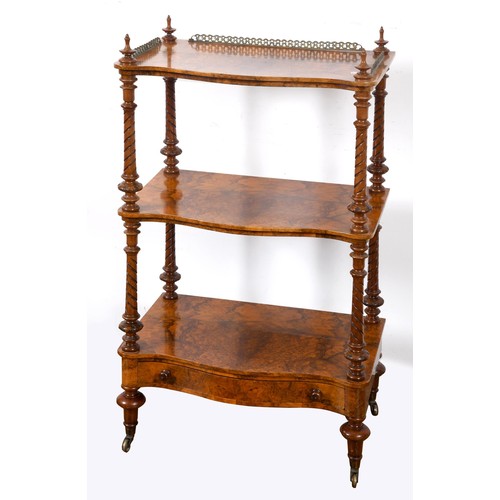 1644 - A late Victorian walnut three tier whatnot, 61 cm wide