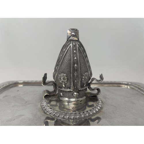 1148 - A silver plated entrée dish and cover, with an Edward VII silver finial, in the form of a bishop's m... 