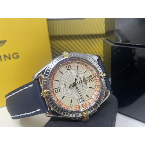 1009 - A gentleman's Breitling, 1884 Wings wristwatch, on a blue leather strap, boxed with paperwork