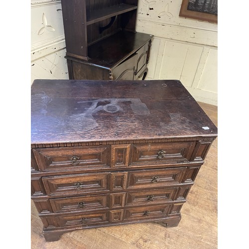 1597 - An 18th/19th century oak chest, having four drawers, 95 cm wide