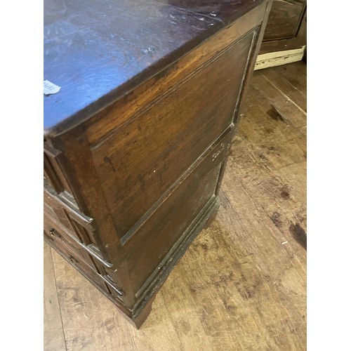 1597 - An 18th/19th century oak chest, having four drawers, 95 cm wide