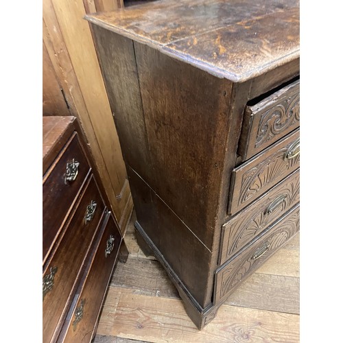 1596 - An oak chest, having two short and three long drawers, 100 cm wide, a wall hanging cupboard and a st... 