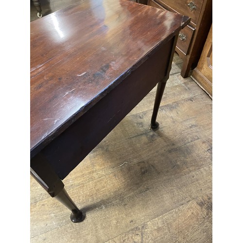 1643 - A 19th century mahogany lowboy, with three drawers, on tapering legs and pad feet, 76 cm wide