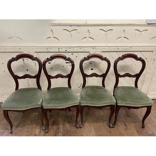 1652 - A 19th century mahogany button back armchair, and a set of four mahogany back dining chairs (5)