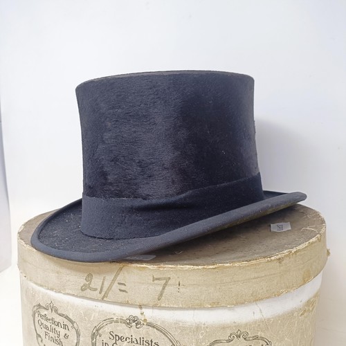 1420 - A Dunn & Co moleskin top hat, boxed, and a christening gown (2)