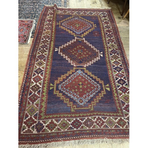 1615 - A Kazak rug, 232 x 143 cm