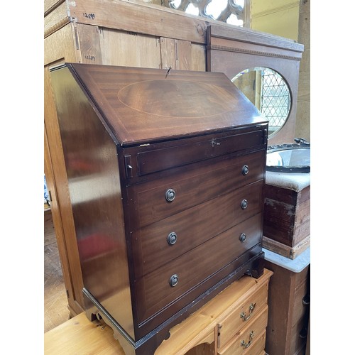 1720 - A mahogany tilt top table, 75 cm diameter, a pine dressing table, a bureau, a mirror, and a pine box... 