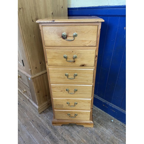 1688 - A pair of pine bedside chests, with three drawers, 46 cm wide, another pair, and a pine chest (5)