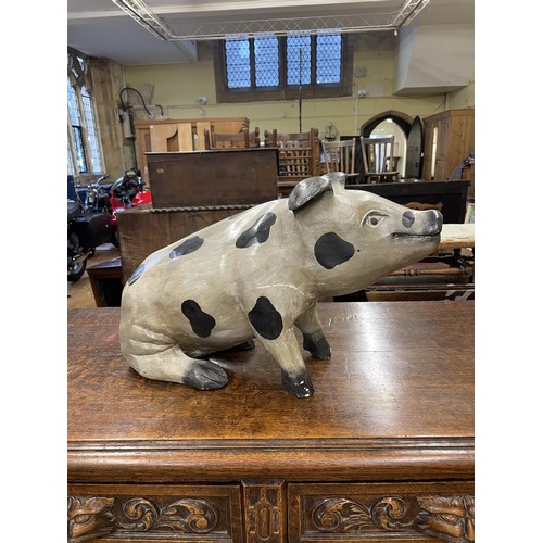 1703 - An oak buffet with folding top with marble insert, 122 cm wide, a painted wooden pig, and assorted p... 