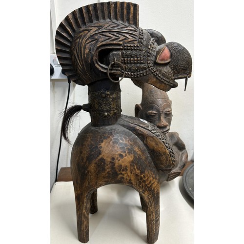 1450 - An African figural pottery jug, 50 cm high, and an African carving, 61 cm high (2)