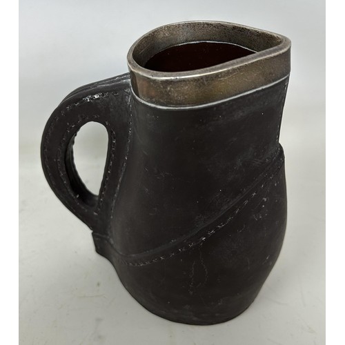 1505 - A Royal Doulton faux leather jug, with a silver mount