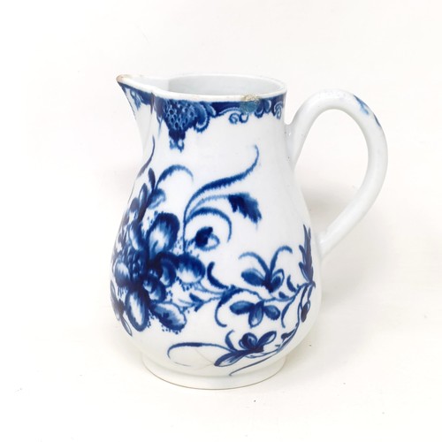 1569 - An early Worcester blue and white cream jug, decorated flowers, crescent moon mark to base, 10 cm hi... 