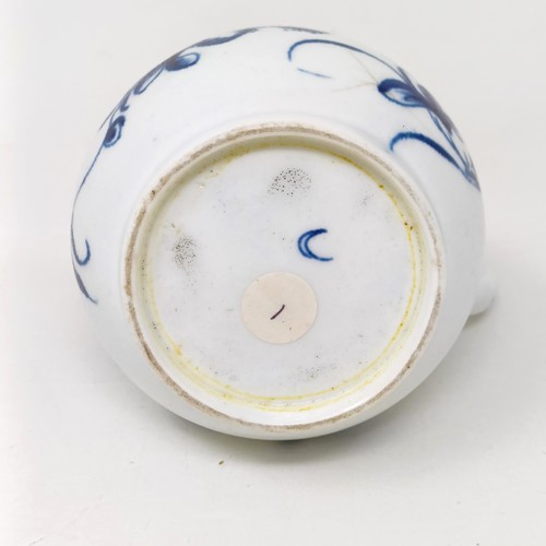 1569 - An early Worcester blue and white cream jug, decorated flowers, crescent moon mark to base, 10 cm hi... 