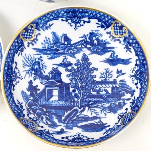 1558 - An 18th/19th century blue and white tea bowl, 17 cm diameter, another, and two saucers (4)