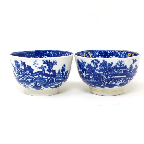 1558 - An 18th/19th century blue and white tea bowl, 17 cm diameter, another, and two saucers (4)