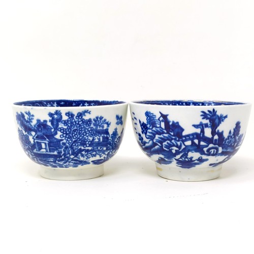 1558 - An 18th/19th century blue and white tea bowl, 17 cm diameter, another, and two saucers (4)