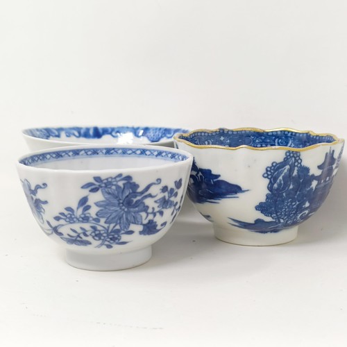 1561 - An 18th/19th century blue and white tea bowl, decorated flowers, diameter 7 cm, and two others (3)