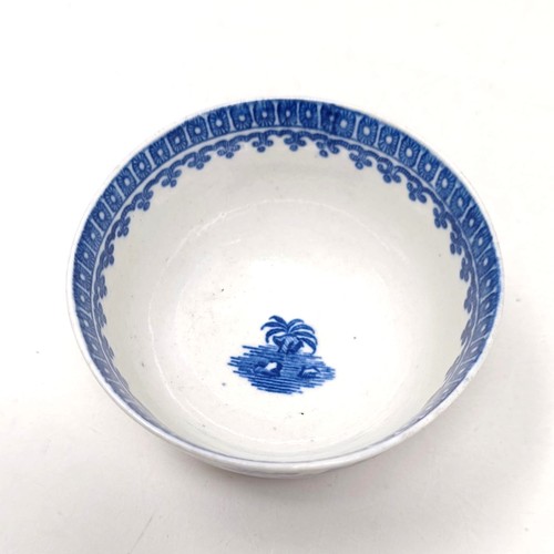 1564 - An early Worcester transfer printed blue and white tea bowl, decorated in the Chinese manner, cresce... 