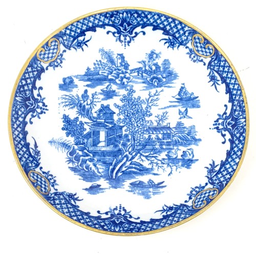 1567 - An early Worcester transfer printed blue and white dish, decorated in  theChinese manner, crescent m... 