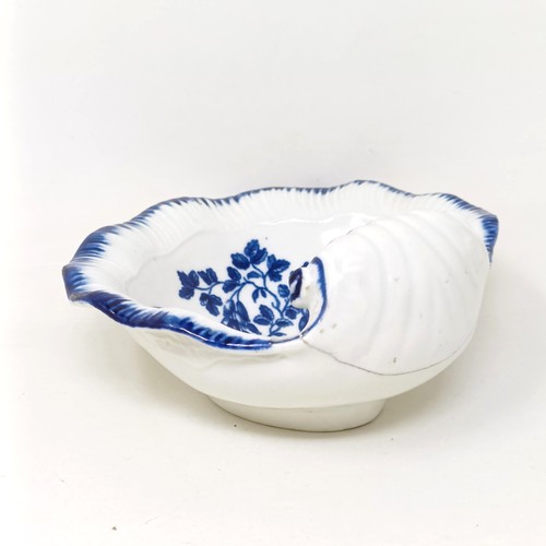 1568 - An early Worcester blue and white shell form bowl, decorated still life of fruit, crescent moon mark... 