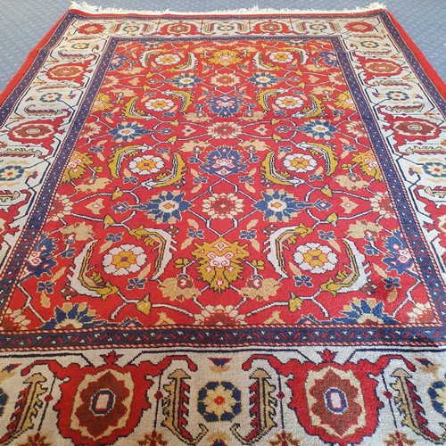 1587 - An Azerbaijan red ground rug, 145 x 107 cm