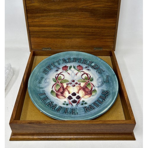 1538 - A limited edition Moorcroft collectors plate,  Spitalfields Market, 1991, 9 cm diameter, in a mahoga... 