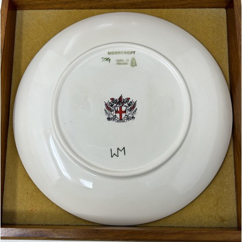 1538 - A limited edition Moorcroft collectors plate,  Spitalfields Market, 1991, 9 cm diameter, in a mahoga... 