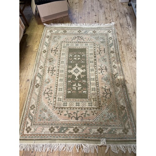 1743 - A Persian style cream ground rug, 170 x 116 cm